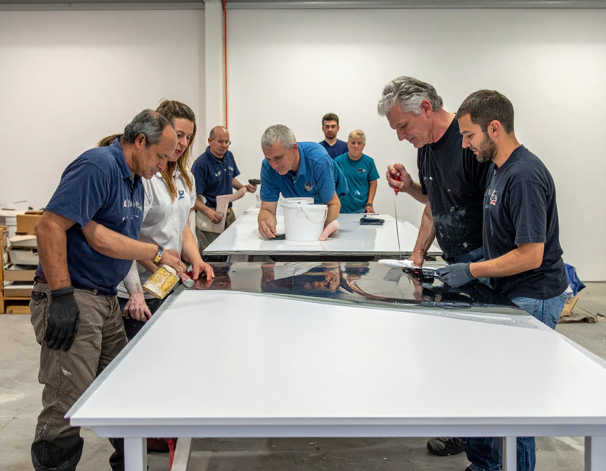 epoxy 101 students working on a showerwall